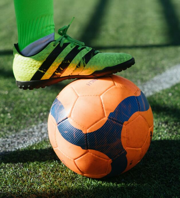 Photo of soccer ball with soccer shoes